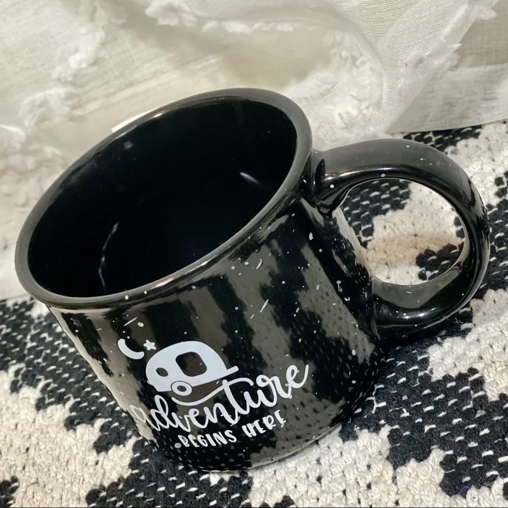 Adventure begins here black ceramic speckled mug